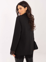 Black blazer with applications.