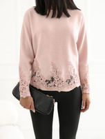 Light pink women's sweater with lace.