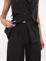 Black women's suit with wide trousers.