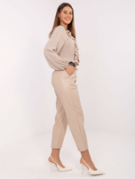 Beżowe skórzane spodnie z kieszeniami RUE PARIS 