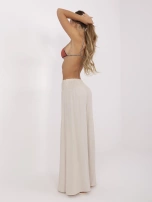 Beige summer pants with a wide elastic band.