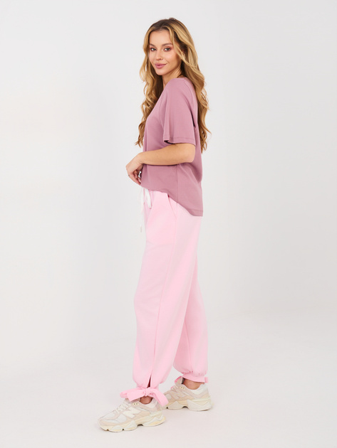 Jasnoróżowe dresowe spodnie z kokardkami