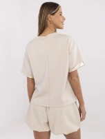 Beżowa bluzka z błyszczącymi wstawkami 