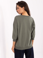 Khaki cotton blouse with a V-neck.