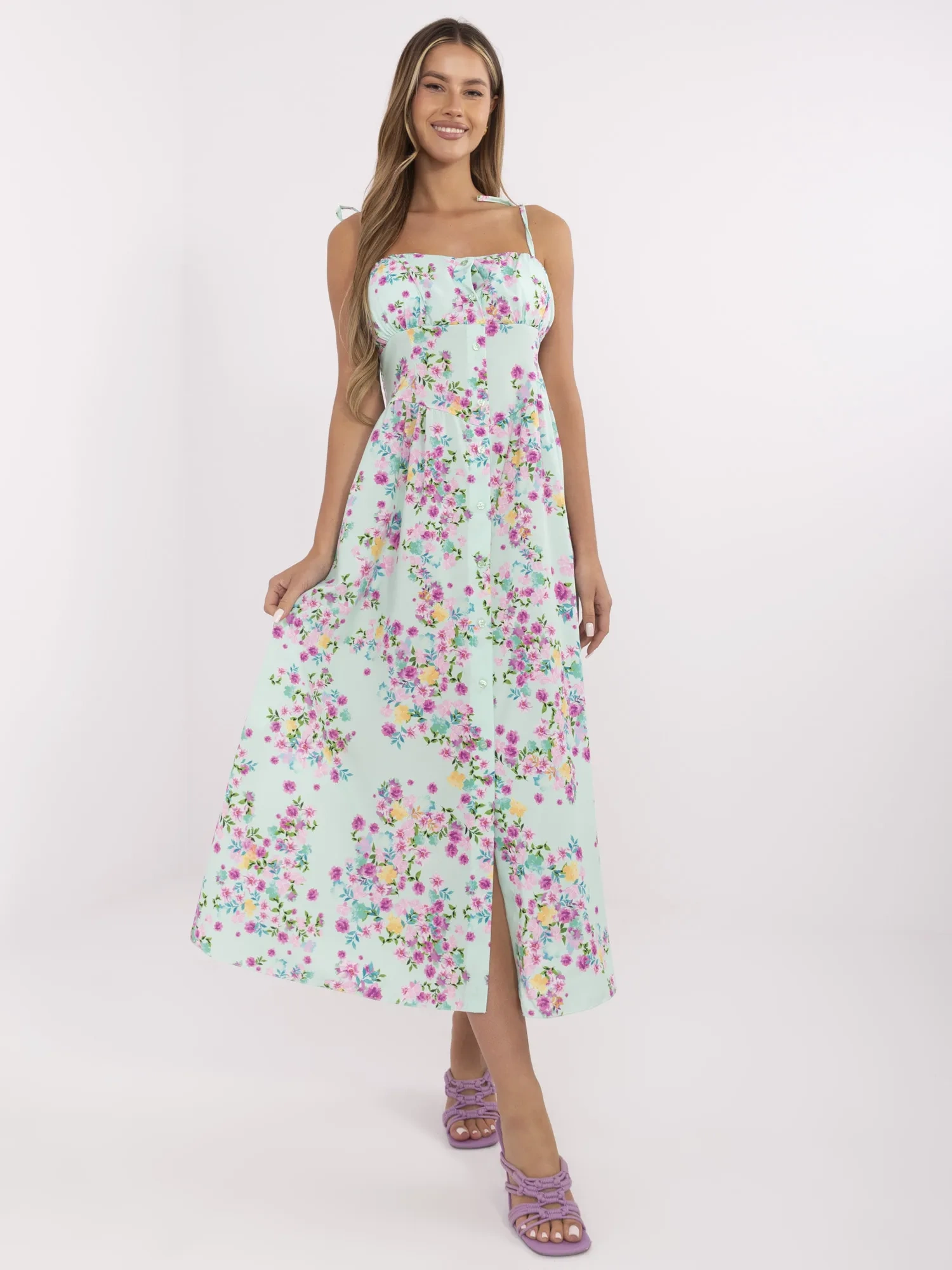 Mint long dress with tied straps.
