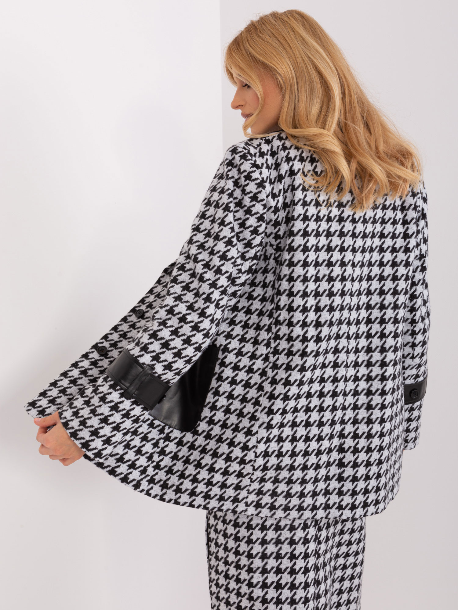 Hurt black-and-white women's jacket in houndstooth.
