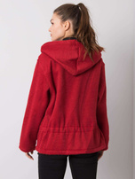 Audrey's burgundy coat
