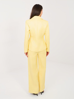 Jasnożółte spodnie z ekoskóry z gumką w pasie 