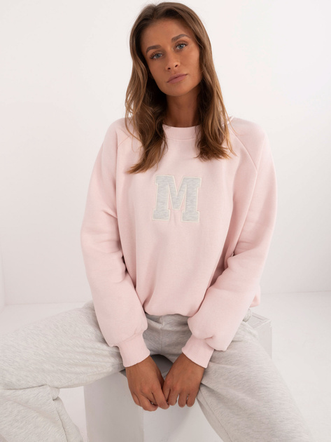 Hurt Jasnoróżowy dresowy komplet oversize z naszywką