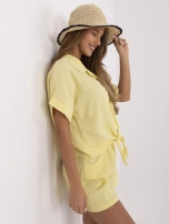 Light yellow muslin shirt with a tie.