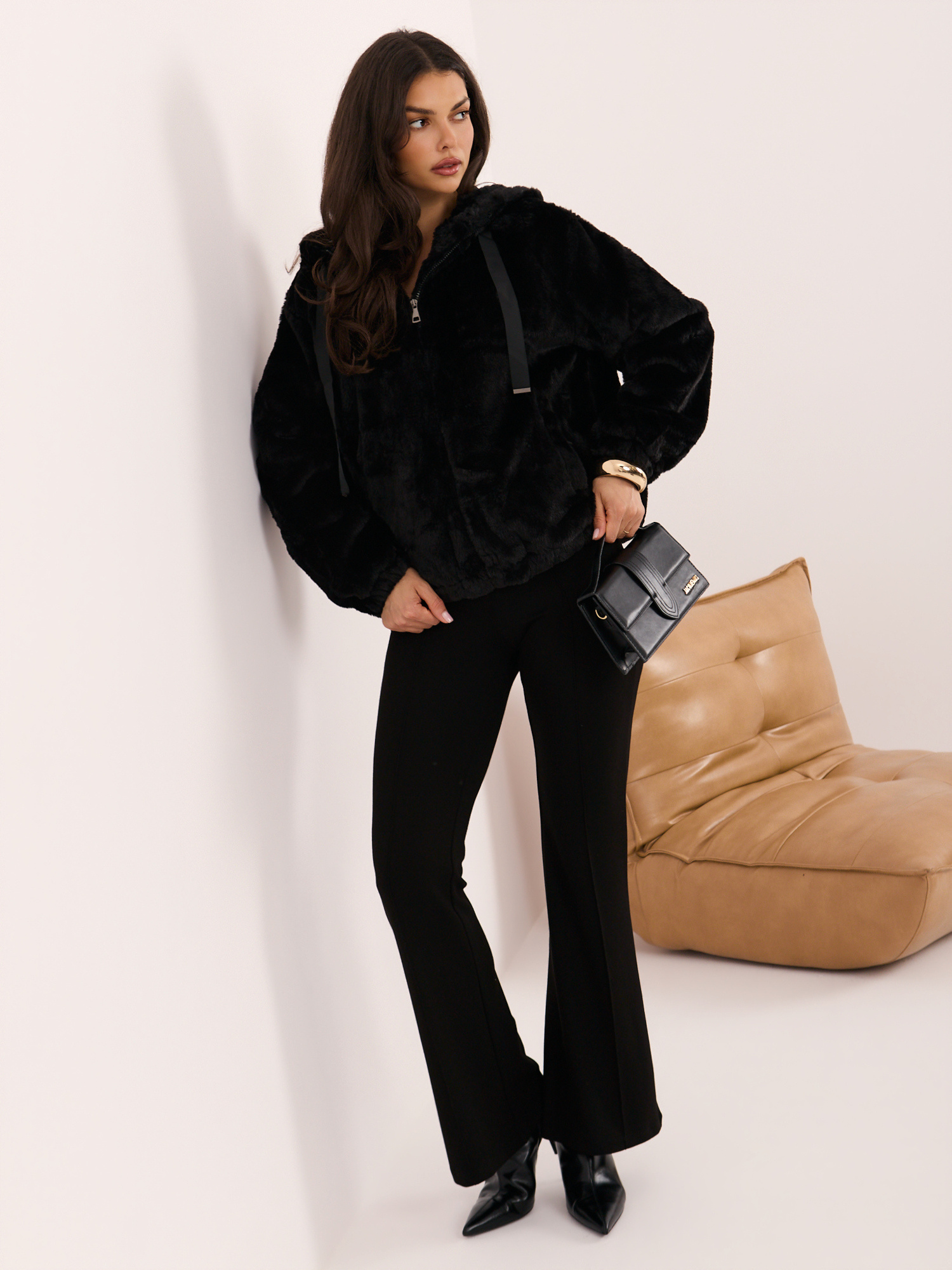 Black fur jacket with a hood.