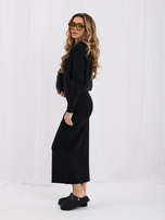 Black sweater set with a midi skirt.