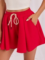 Red sweat shorts with wide leg.