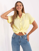 Light yellow muslin short-sleeved shirt.