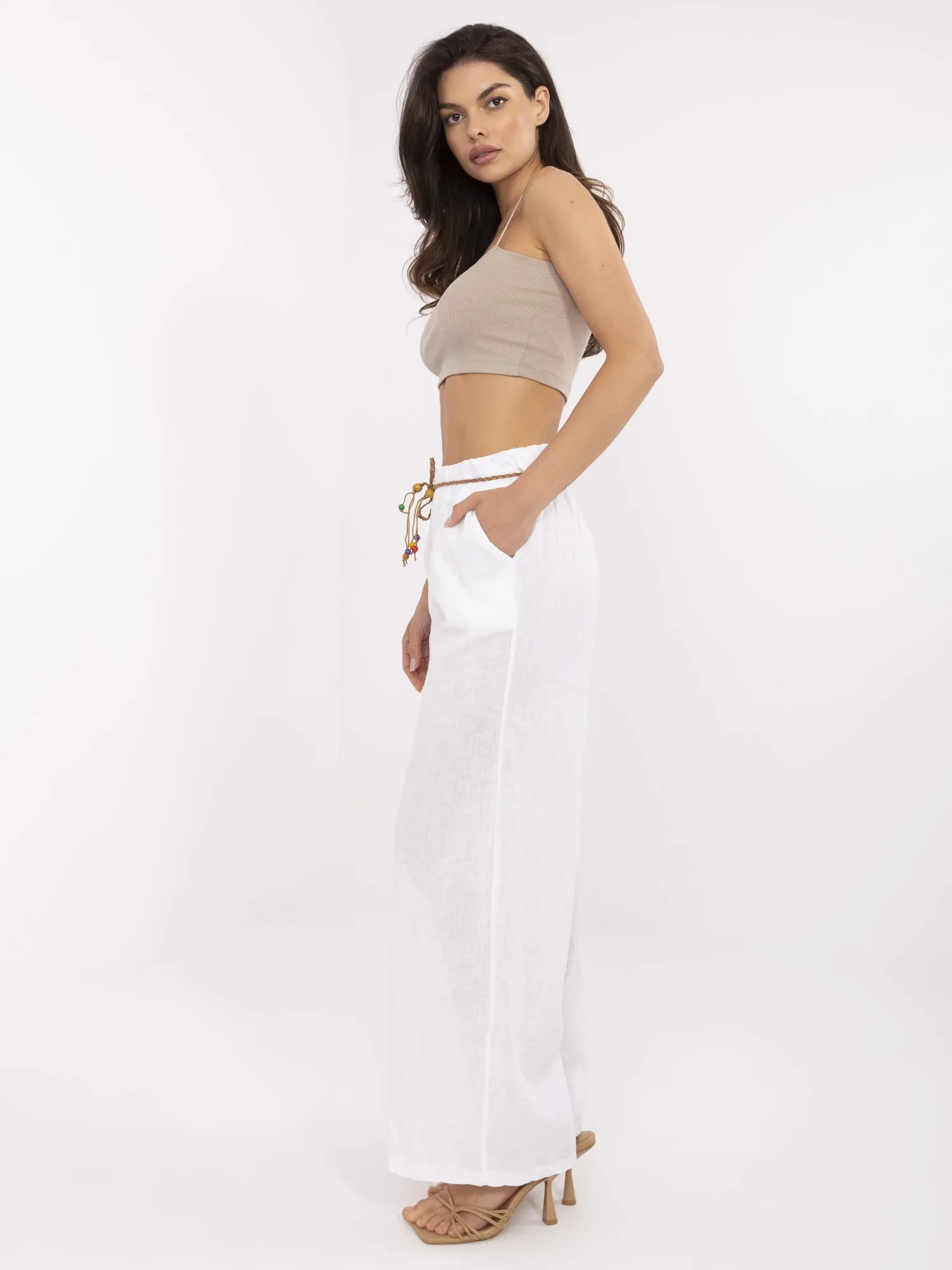 White summer pants with a woven belt.