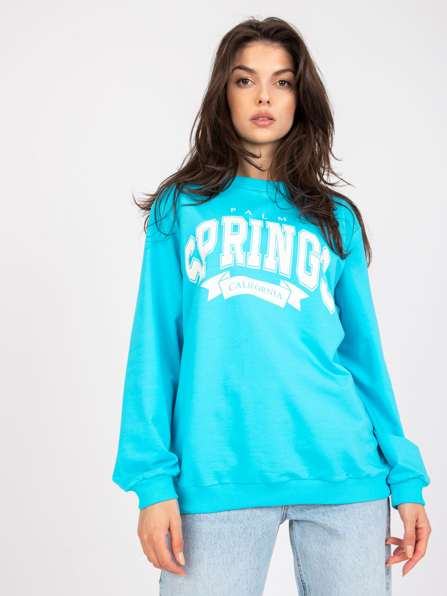 Modra-bela oversize bluza brez kapuce z žepi.
