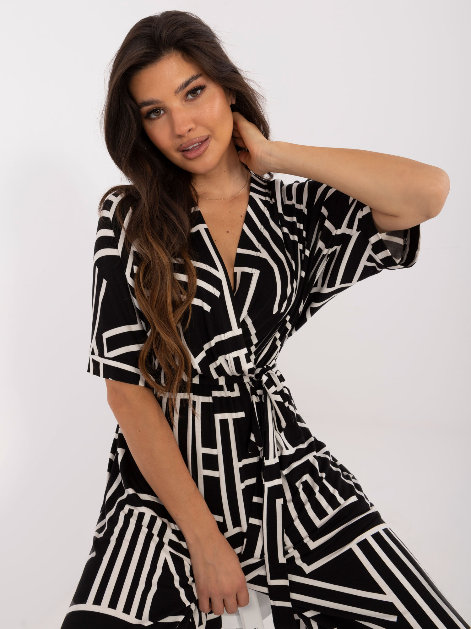 Hurt black patterned jumpsuit with a tie on the back.