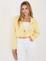Jasnożółta krótka marynarka z broszką 