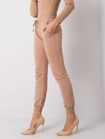 Camelowe spodnie Faster