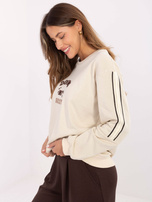 Jasnobeżowa bluza oversize z naszywką 