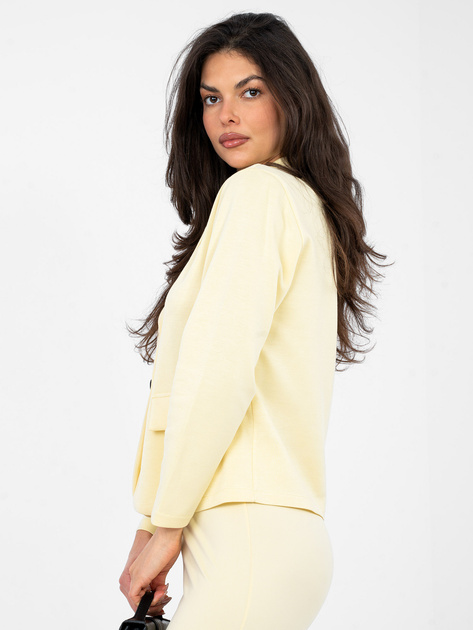 Pastelowa żółta marynarka o dopasowanym kroju