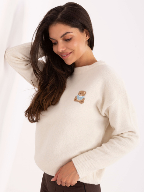 Jasnobeżowy damski sweter z naszywką misia