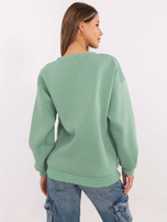 Hurt Pistacjowa bluza bez kaptura z naszywkami
