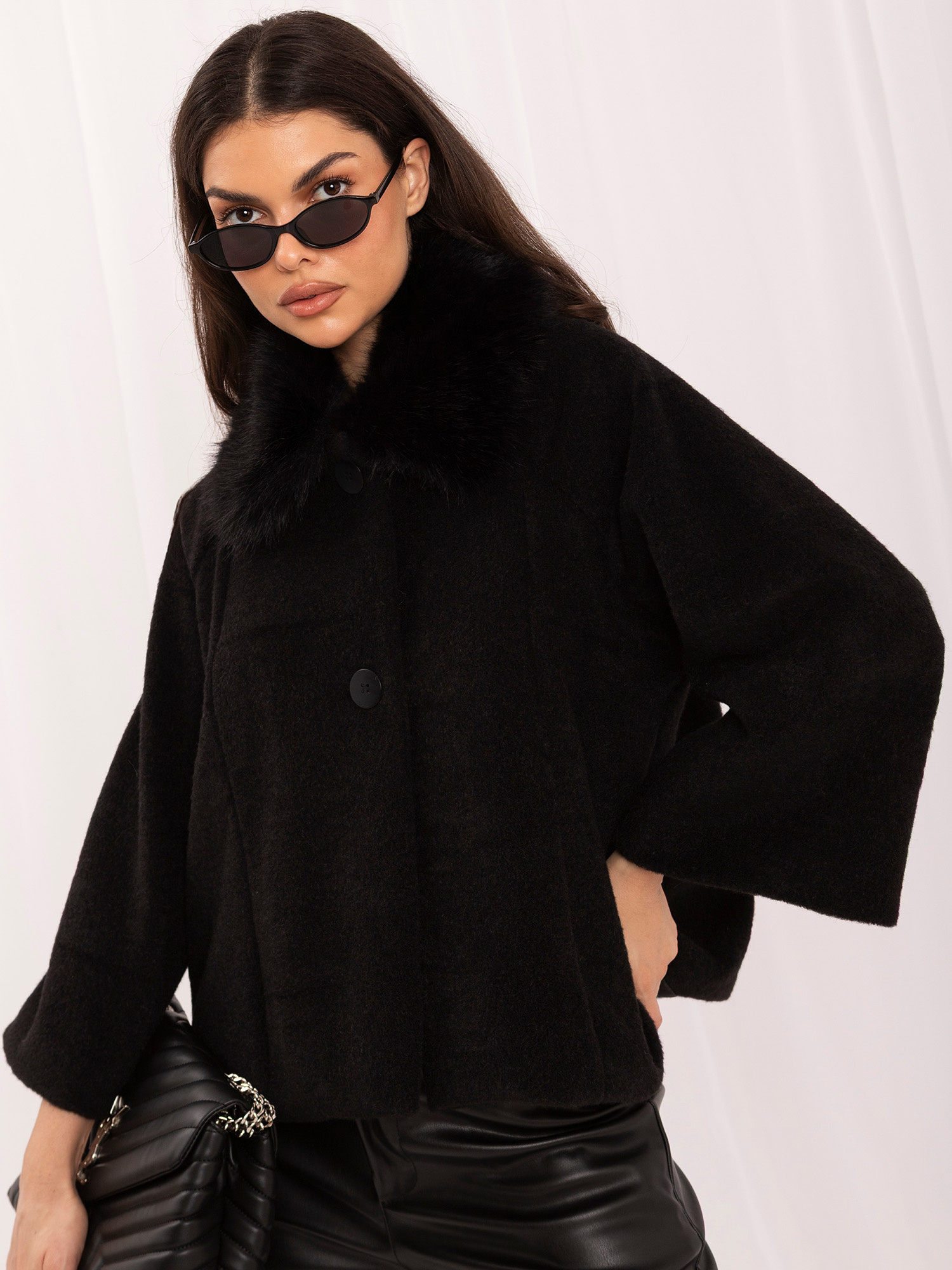 Black short coat with a fur collar.