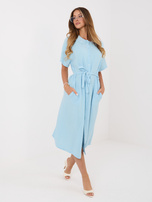 Light blue muslin dress with a tied belt.