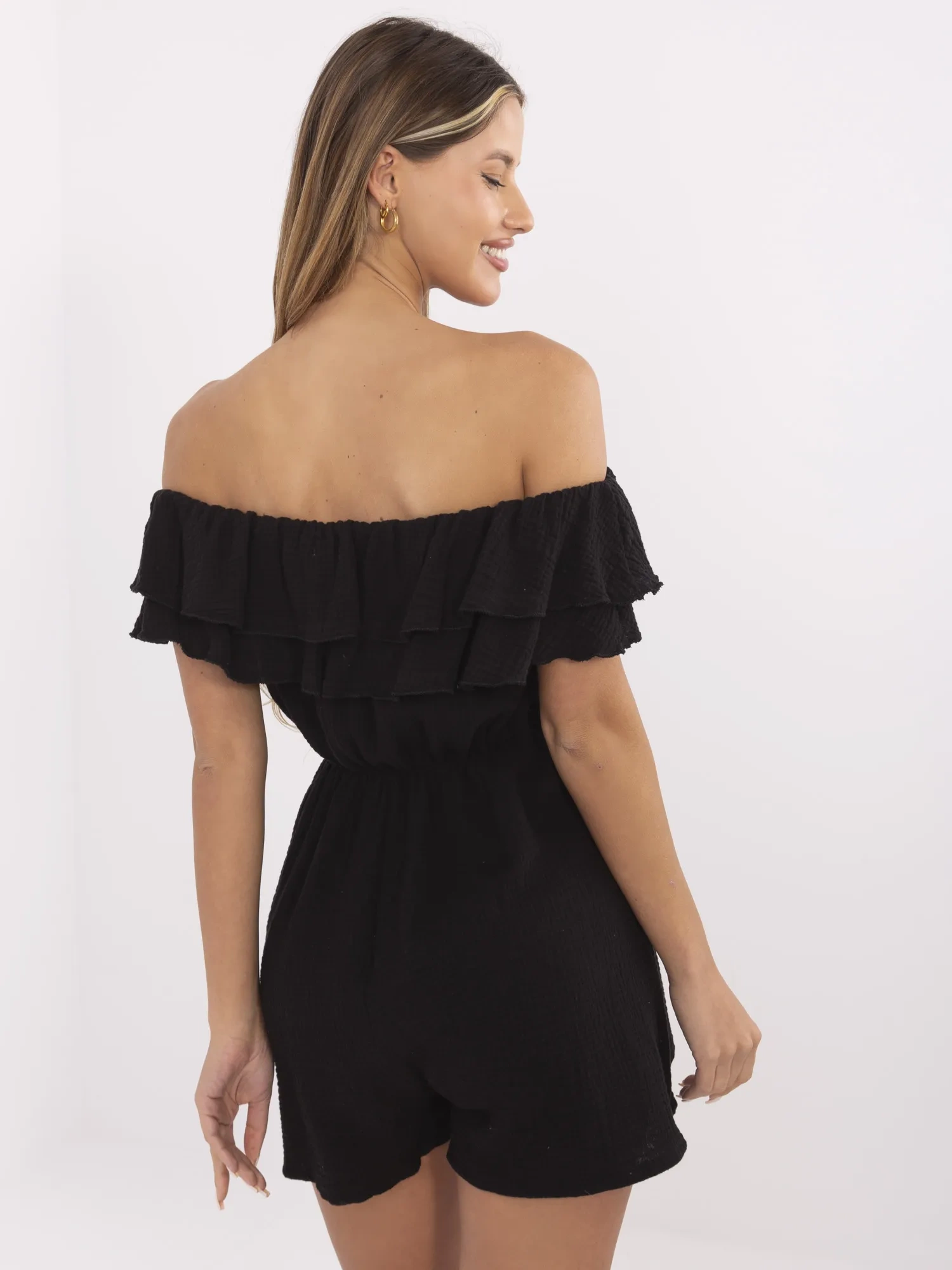 Black muslin jumpsuit with shorts.