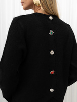 Black fluffy cardigan with a round neckline.