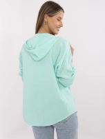 Mint green button-up women's shirt made of muslin.