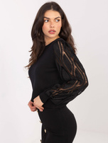 Black women's sweater with puff sleeves.