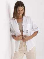 White muslin shirt with button closure.