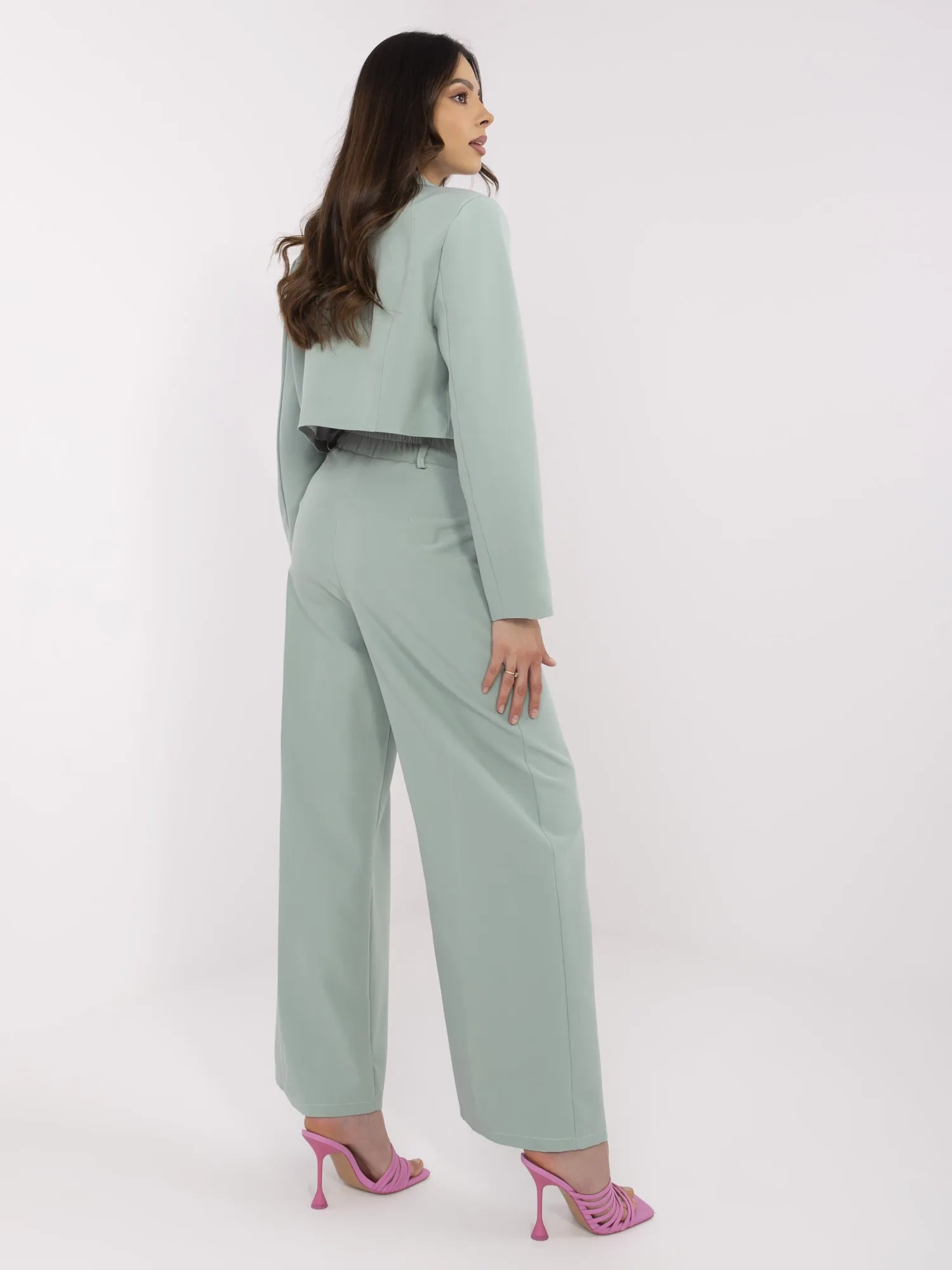 Pistachio suit with pleats on the pants.