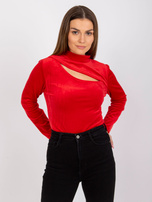 Red velour blouse with a cutout at the neckline of Kigali