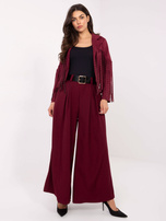 Burgundy suit trousers with wide legs.