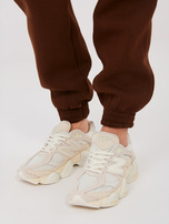 Basic chocolate sweatpants with a tie.