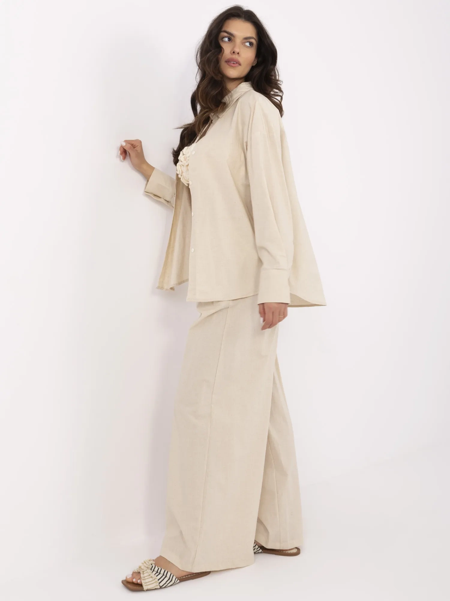 Beige two-piece set with linen addition.