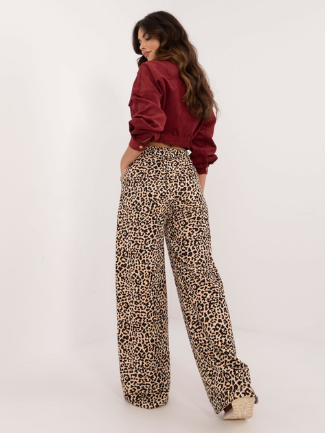 Hurtownia Beżowo-czarne długie spodnie w panterkę