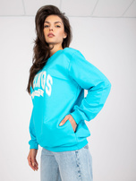 Modra-bela oversize bluza brez kapuce z žepi.