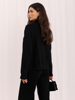 Black zip-up sweater with a stand-up collar.