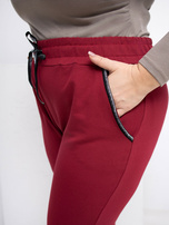 Bordové teplákové kalhoty plus size s vázáním.