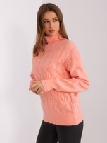 Hurt Brzoskwiniowy damski golf z warkoczami