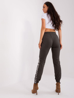 Hurt women's khaki sweatpants with a tie.