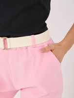 Jasnoróżowe sztruksowe spodnie typu carrot