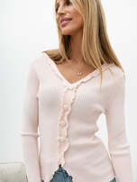 Light pink fitted sweater with a V-neck.