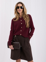 Burgundy women's cardigan with gold buttons.