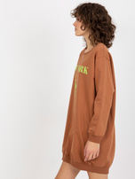 Hurt hellbraun-grüne lange Oversize-Bluse mit Druck.