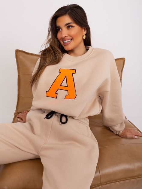 Hurt Beżowo-fluo pomarańczowy komplet dresowy z naszywką